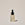 A clear glass bottle with a dropper containing the Brightening Glow Serum, labeled with the brand ACURE.